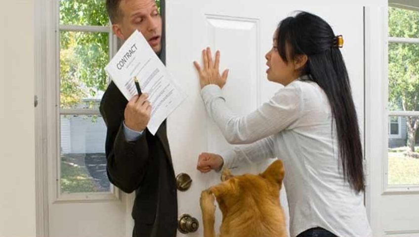 A woman and a dog blocking the door